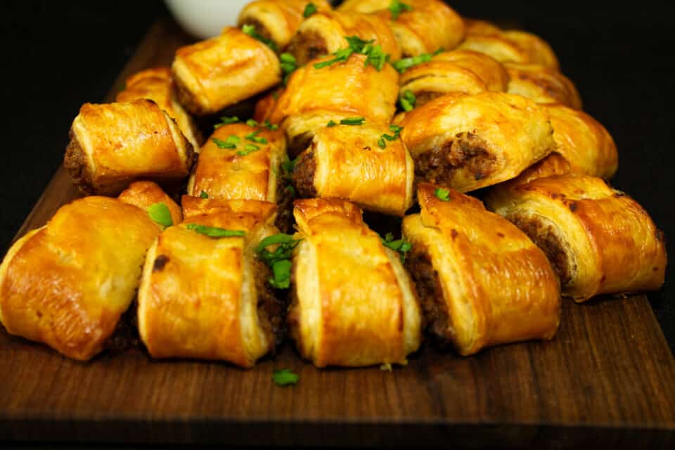 Image of assorted pies and sausage rolls